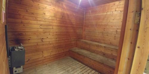 a wooden sauna with a wood paneled wall at Horizon Red Sea in Eilat