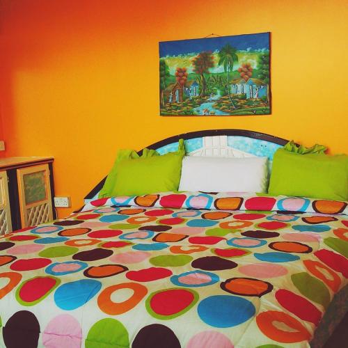 Una cama o camas en una habitación de Villa Des Pitons