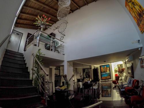 a large staircase leading up to a large room at La Cabrera Hotel Boutique in Neiva