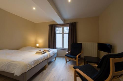 Una cama o camas en una habitación de B&B 't Maanhof