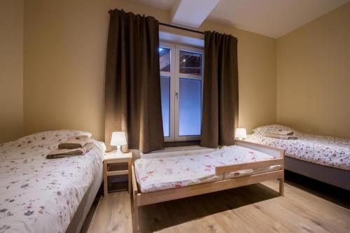 Una cama o camas en una habitación de B&B 't Maanhof