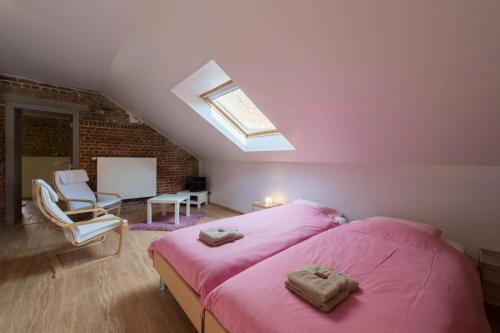 Una cama o camas en una habitación de B&B 't Maanhof