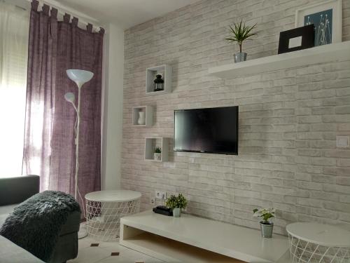 Televízia a/alebo spoločenská miestnosť v ubytovaní Apartamento Capuchinos