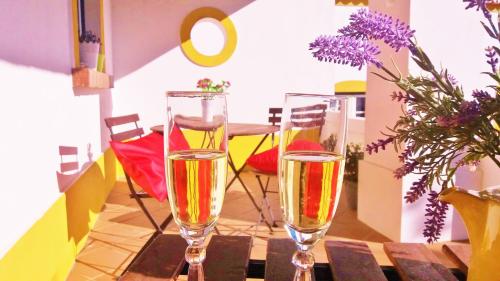 two glasses of champagne sitting on a table at Agro-Turismo Monte da Galega in Mina de São Domingos