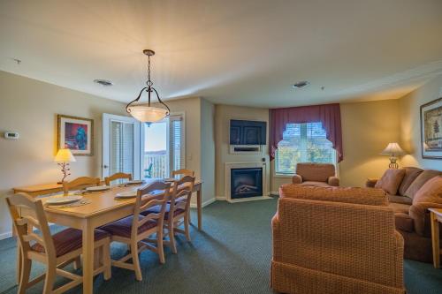 a dining room and living room with a table and chairs at Vacation Village in the Berkshires in Hancock