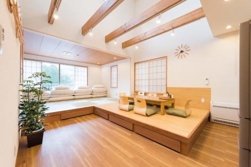 a living room with a couch and a table at Guest Villa Hakone Miyanoshita in Hakone