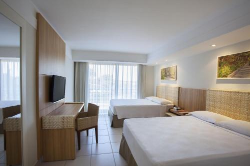 Кровать или кровати в номере Rio Quente Resorts - Hotel Turismo