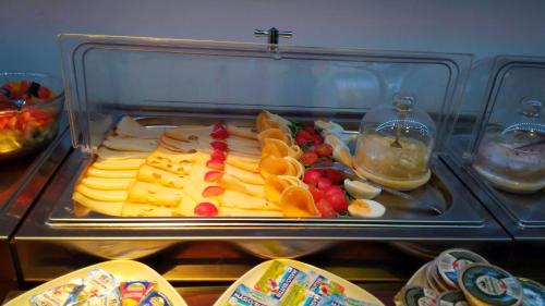 a plastic container with fruits and vegetables on a tray at Ruby Blue in Ostrava