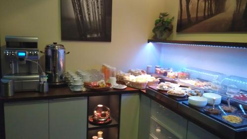 a kitchen with a buffet of food on a counter at Ruby Blue in Ostrava