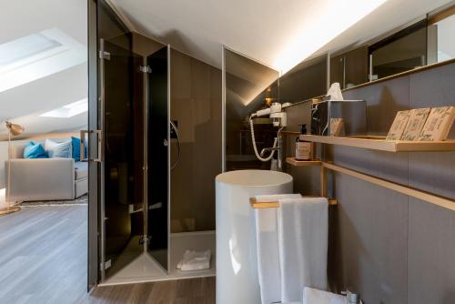 a bathroom with a shower and a sink at Up Hotel in Rimini