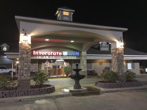 an entrance to a inn at night at Interstate Inn in Roland