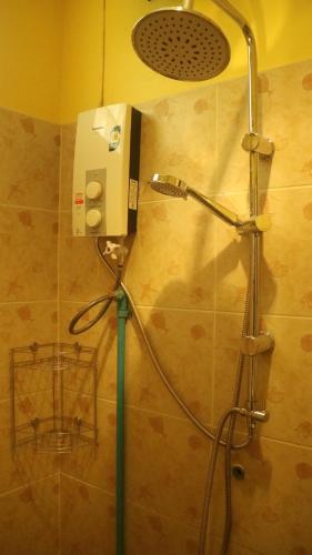 a shower in a bathroom with a shower head at Island Lodge in Ko Chang