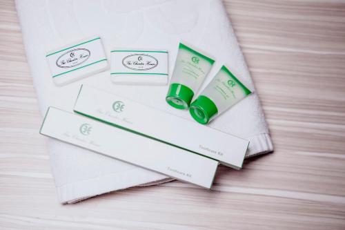 a pile of white envelopes with green products on a table at The Charter House in Manila