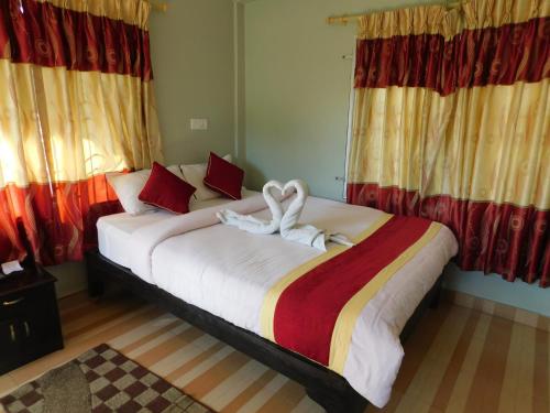 Un ou plusieurs lits dans un hébergement de l'établissement Harvest Moon Guest House