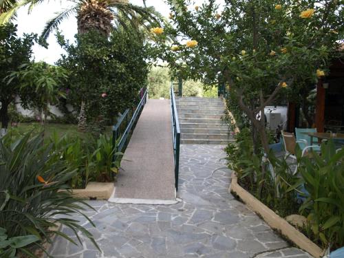 a stairway leading up to a set of stairs at Kastro Studios Apartments in Myrtos