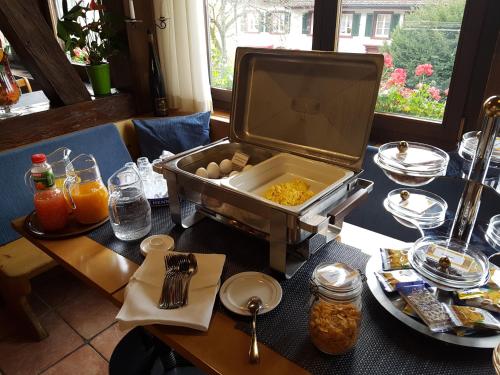 a table with a box of eggs on top of it at Hotel Eremitage in Arlesheim
