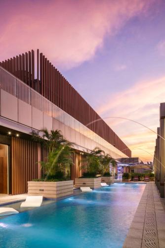 a rendering of the exterior of a building with a pool at Hard Rock Hotel Shenzhen in Shenzhen