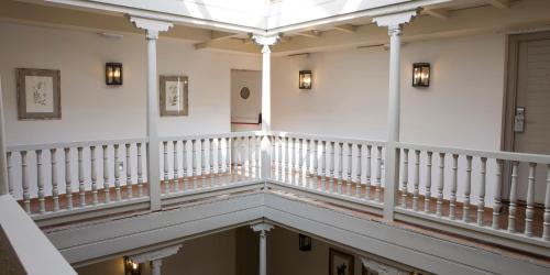 a staircase in a building with a glass ceiling at Palacio De Los Navas in Granada