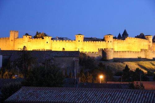 a large castle sitting on top of a hill at Domaine La Sauzette in Cazilhac