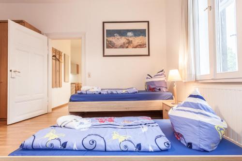 Katil atau katil-katil dalam bilik di Gästehaus Villa Rose
