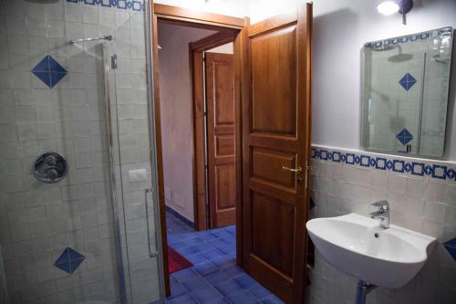 a bathroom with a sink and a shower at Terrazze sul Tirreno in Lascari
