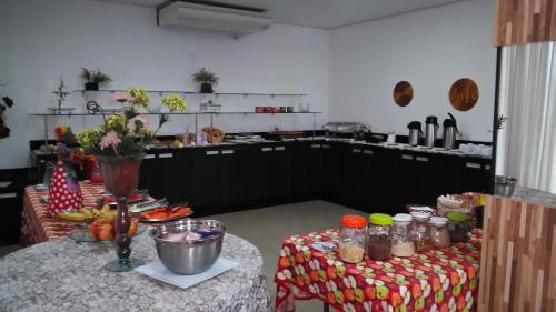 a kitchen with a table with food on it at Jalapão Hotel in Palmas