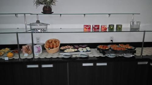 a table with many different types of food on at Jalapão Hotel in Palmas