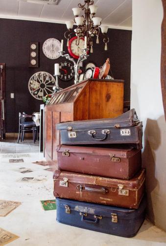 a pile of suitcases stacked on top of each other at Premier Hotel and Spa Cullinan in Cullinan