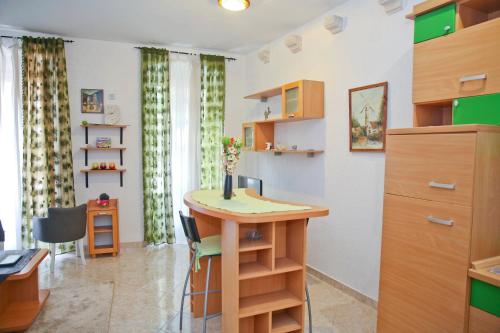 a room with a desk and a table in a room at Old town Kotor Square in Kotor