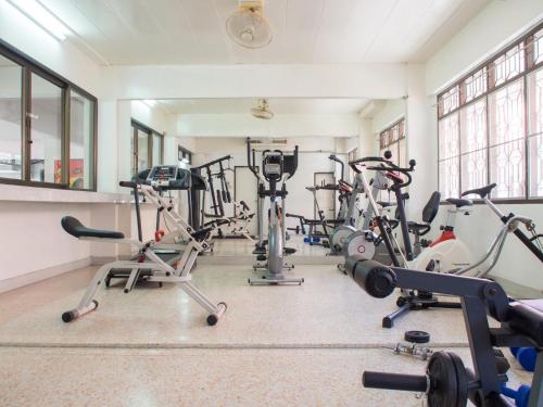 a gym with several exercise bikes in a room at Jaroonwej Bangsaen in Bangsaen