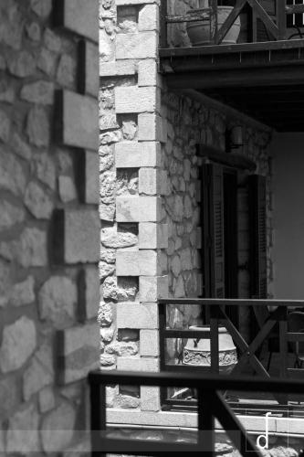 a black and white photo of a stone building at Abelos Villas in Áyios Ioánnis