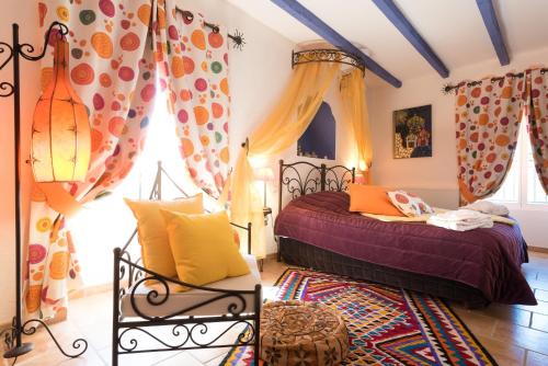 Postel nebo postele na pokoji v ubytování Le Moulin de Beaunette