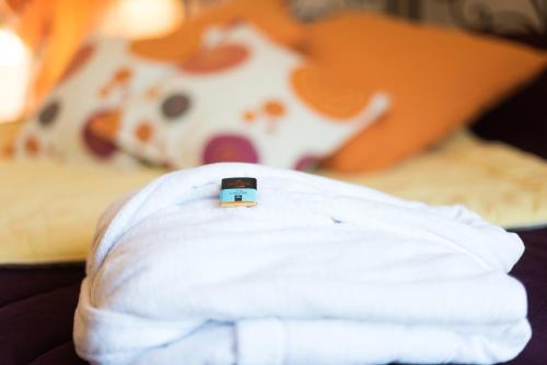 a cell phone sitting on top of a napkin at Le Moulin de Beaunette in Grane