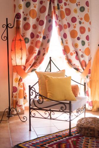 a room with a bench in front of a window at Le Moulin de Beaunette in Grane