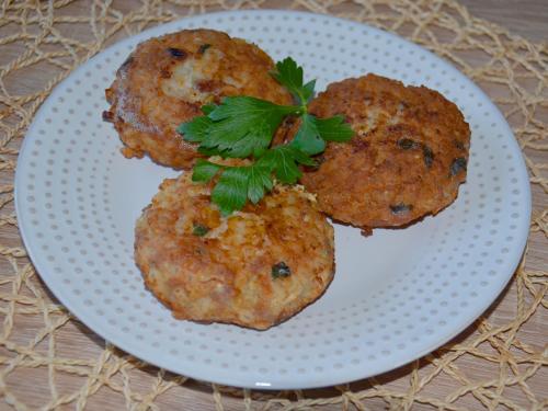 a white plate with three muffins on a table at Młynarzowa Chata in Lesko