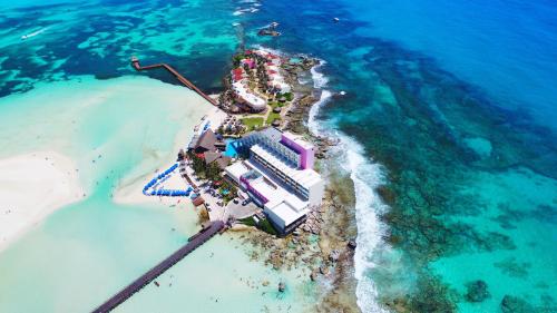 an aerial view of a resort on an island in the ocean at Mia Reef Isla Mujeres - All Inclusive Resort in Isla Mujeres