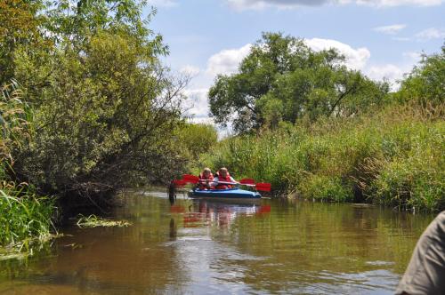 a group of people in a boat on a river at Pokoje Gościnne AGA in Kazimierz Dolny