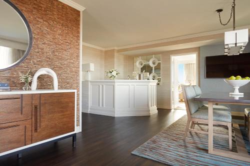 a kitchen with a table and a dining room at Lansdowne Resort and Spa in Leesburg