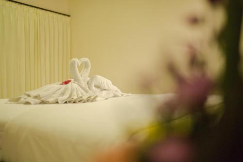 Ένα ή περισσότερα κρεβάτια σε δωμάτιο στο Wingsu Guest House