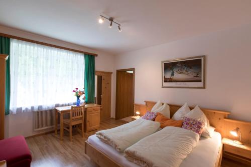 A bed or beds in a room at Gasthof - Restaurant Bernthaler