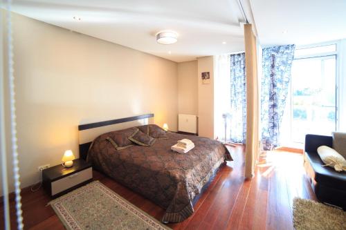 Llit o llits en una habitació de Kavoliuko 2A Apartments