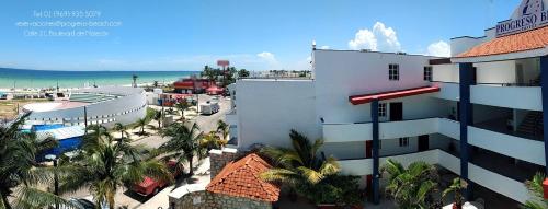 an aerial view of a hotel and the beach at Progreso Beach Hotel in Progreso