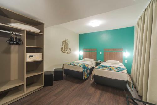 Säng eller sängar i ett rum på Castelmar Hotel