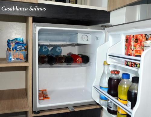 an open refrigerator filled with drinks and drinks at Hotel Casablanca Salinas in Salinas