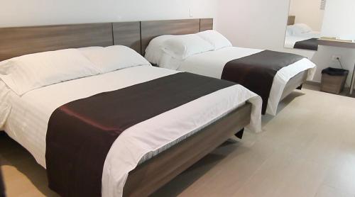 Postel nebo postele na pokoji v ubytování BGA Hotel