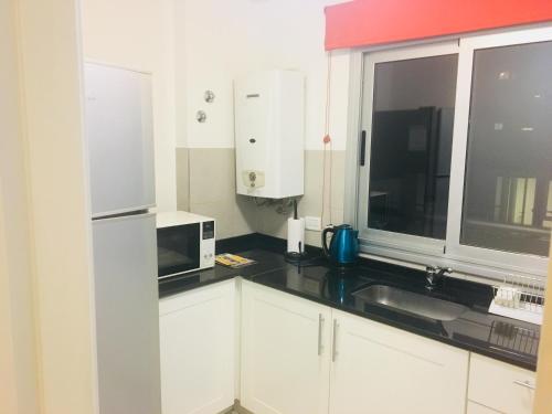 Køkken eller tekøkken på Departamentos Mediterraneo