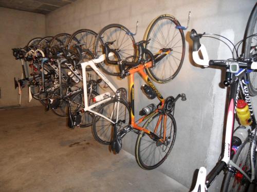 a bunch of bikes are lined up against a wall at La Grande Eperviere in Barcelonnette