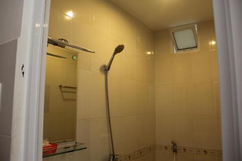a bathroom with a shower with a shower head at Sai Gon River Hotel in Ho Chi Minh City
