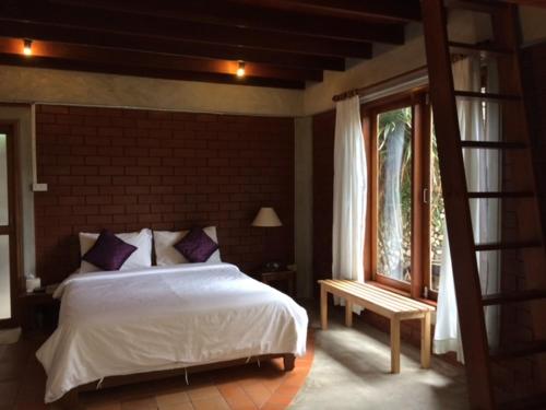 Voodi või voodid majutusasutuse Rachavadee Bankrut Resort toas