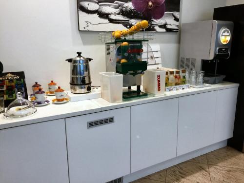 a white counter with food on top of it at Hotel Byron in Rimini